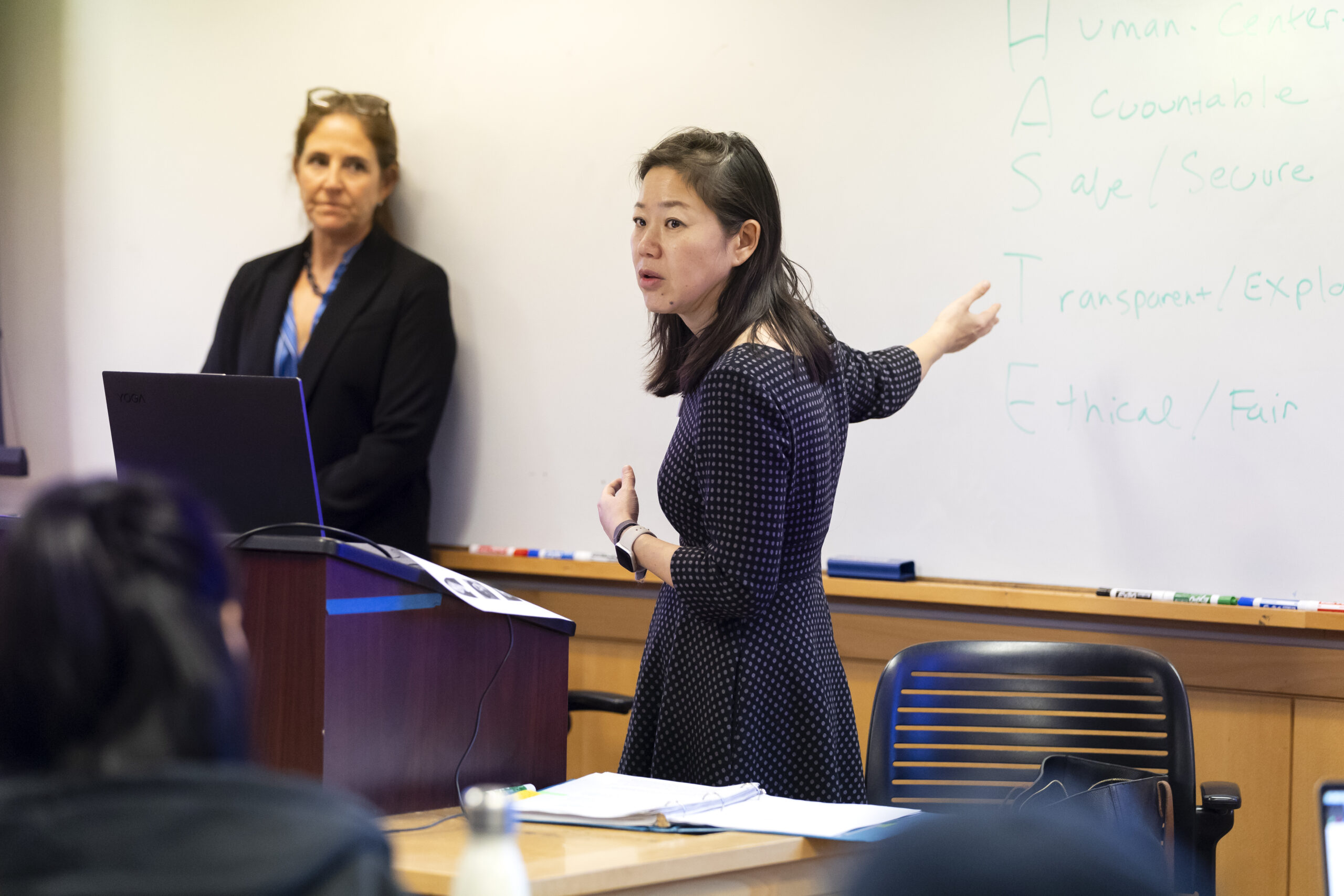 UC Berkeley professor Colleen V. Chien stands gesturing towards a whiteboard