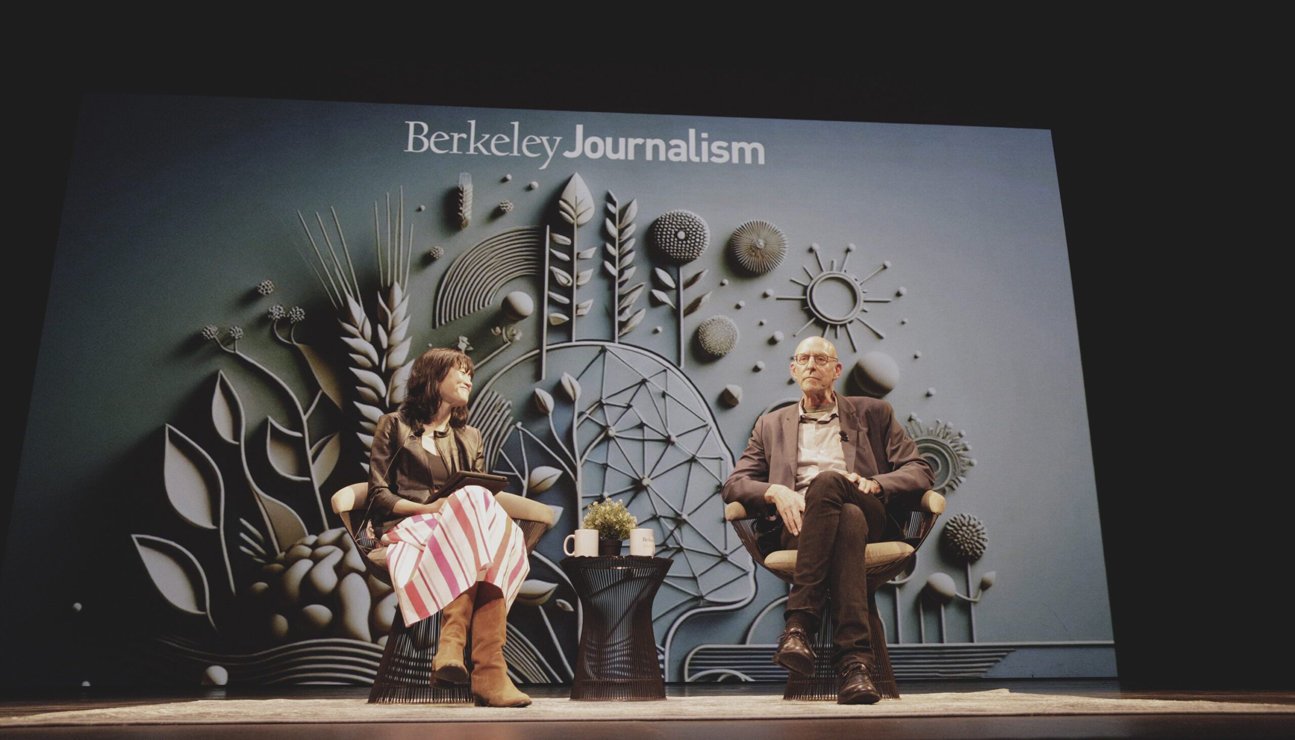 Michael Pollan and Mina Kim sit on stage in conversation