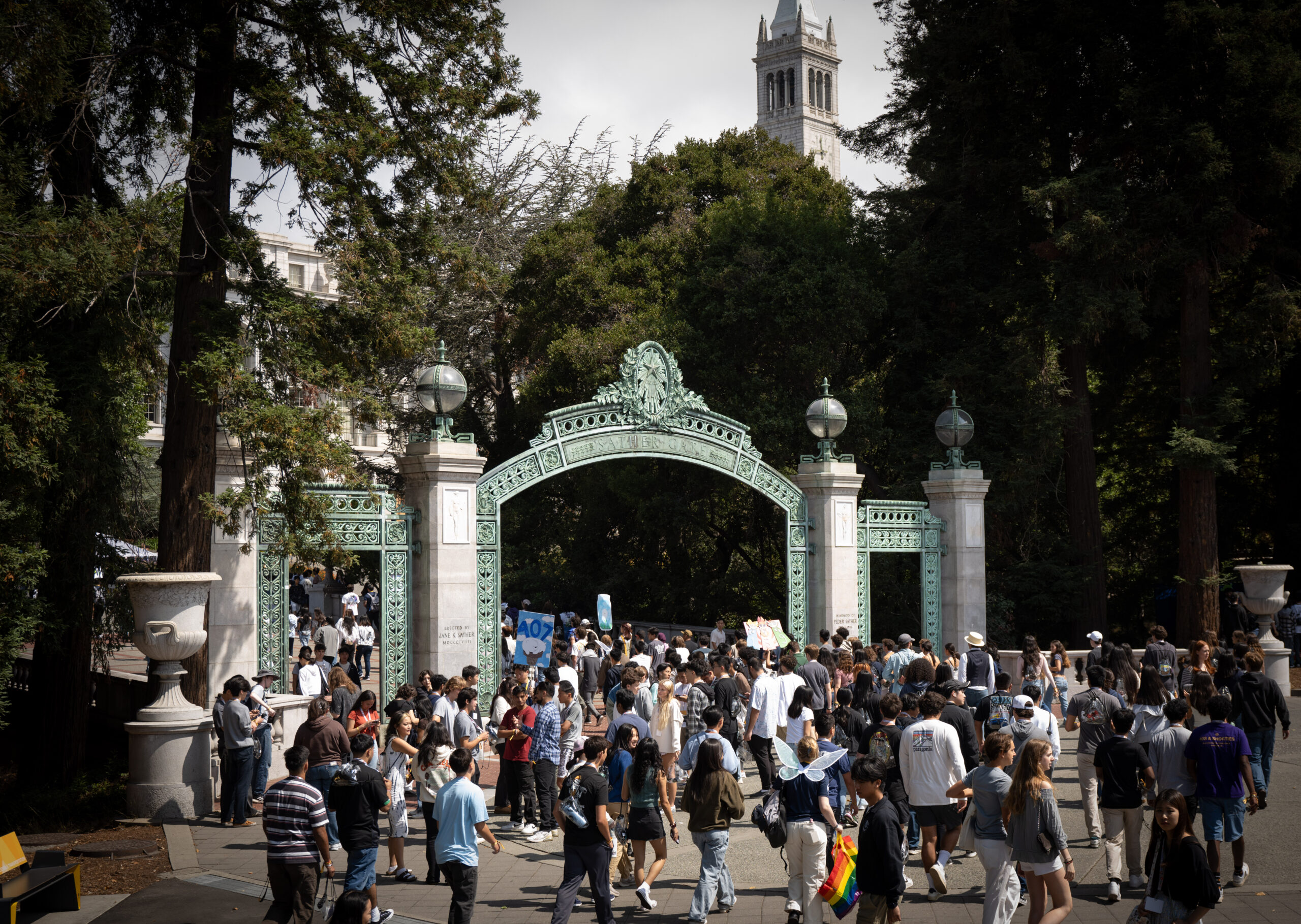 Students stream out of convocation and through Sather Gate.