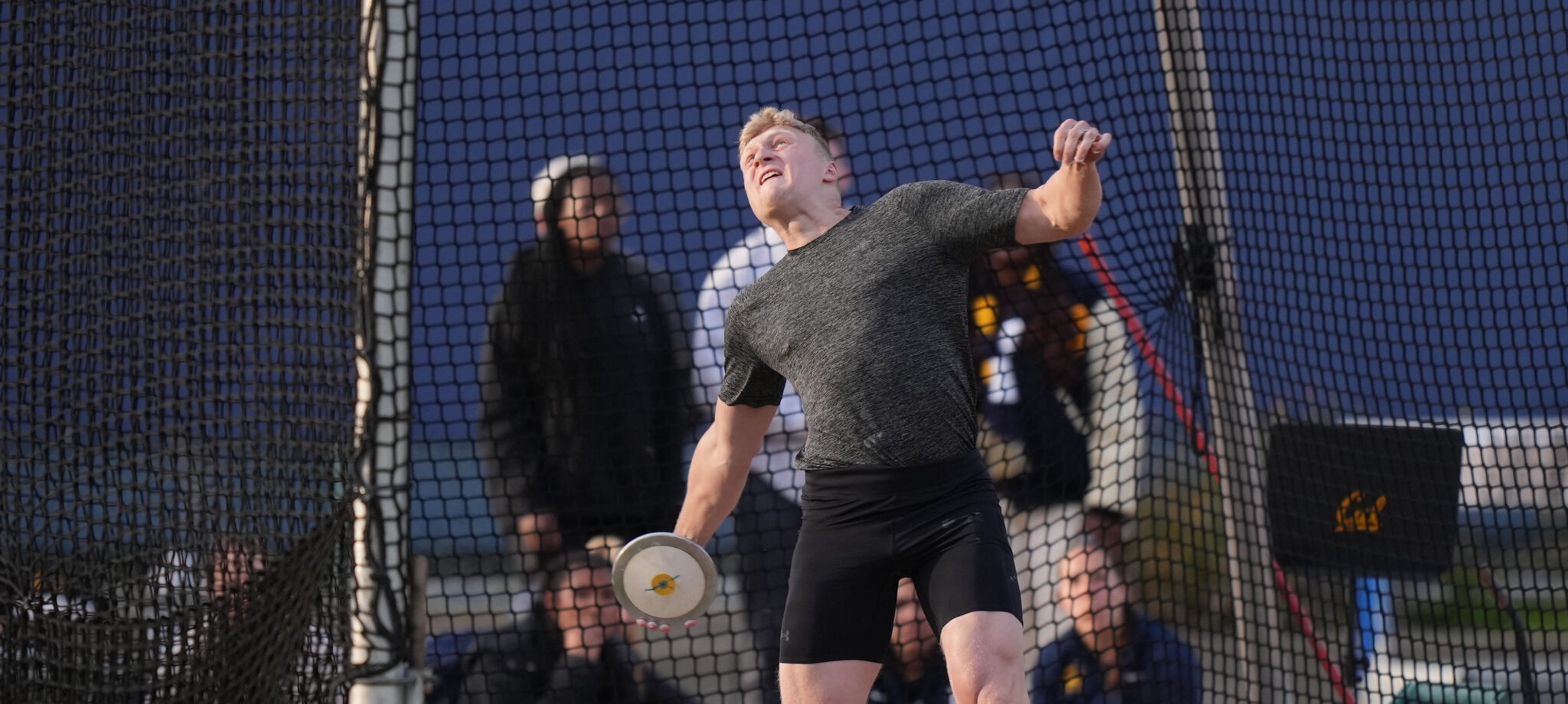 Mykolas Alenka throws a discus at Edwards Stadium