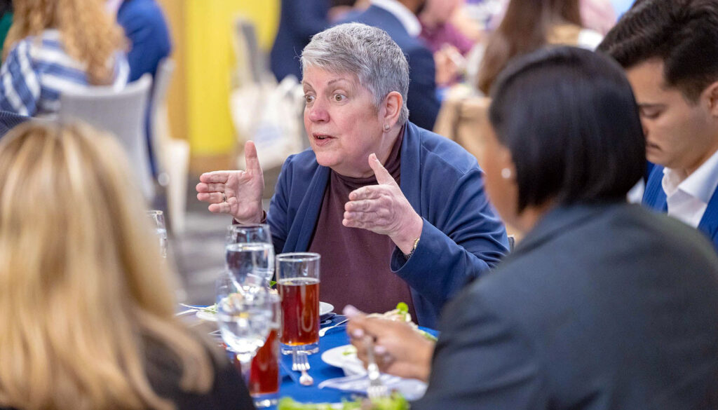 Janet Napolitano, a prominent U.S. national security expert and former president of the University of California system, talks with students and others during the Uncommon Table event.