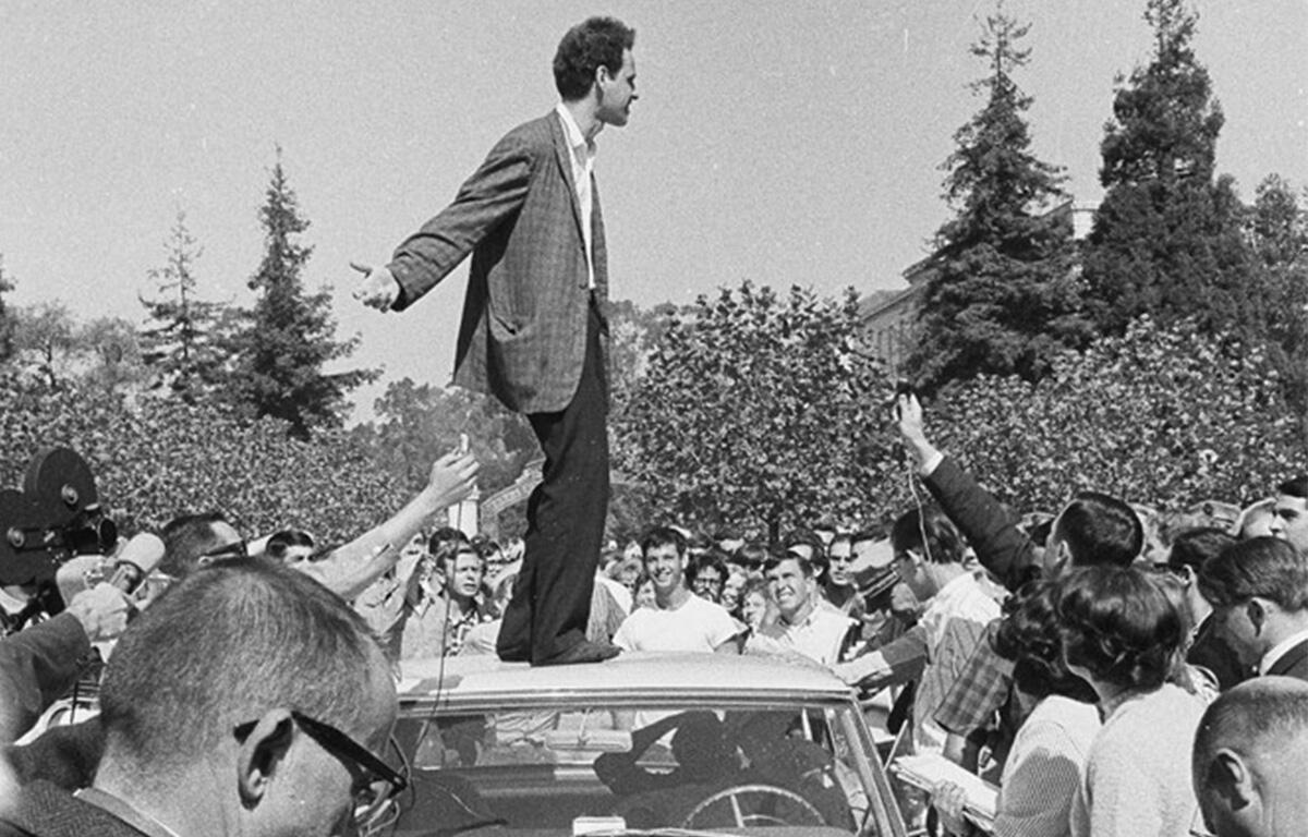 Mario Savio speaking from the top of a police car