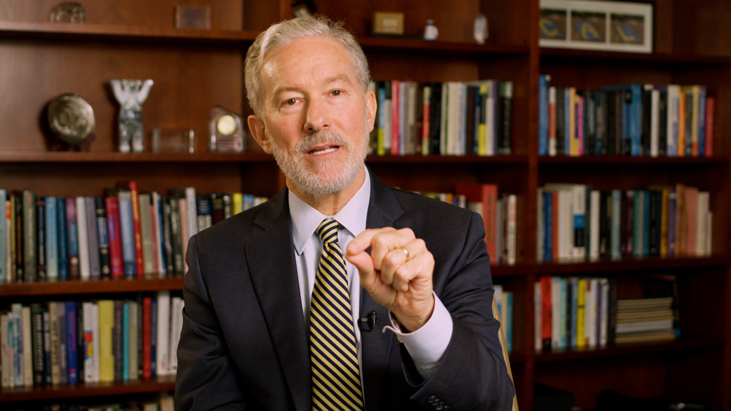 A still image of Chancellor Rich Lyons looking at and gesturing towards the camera.