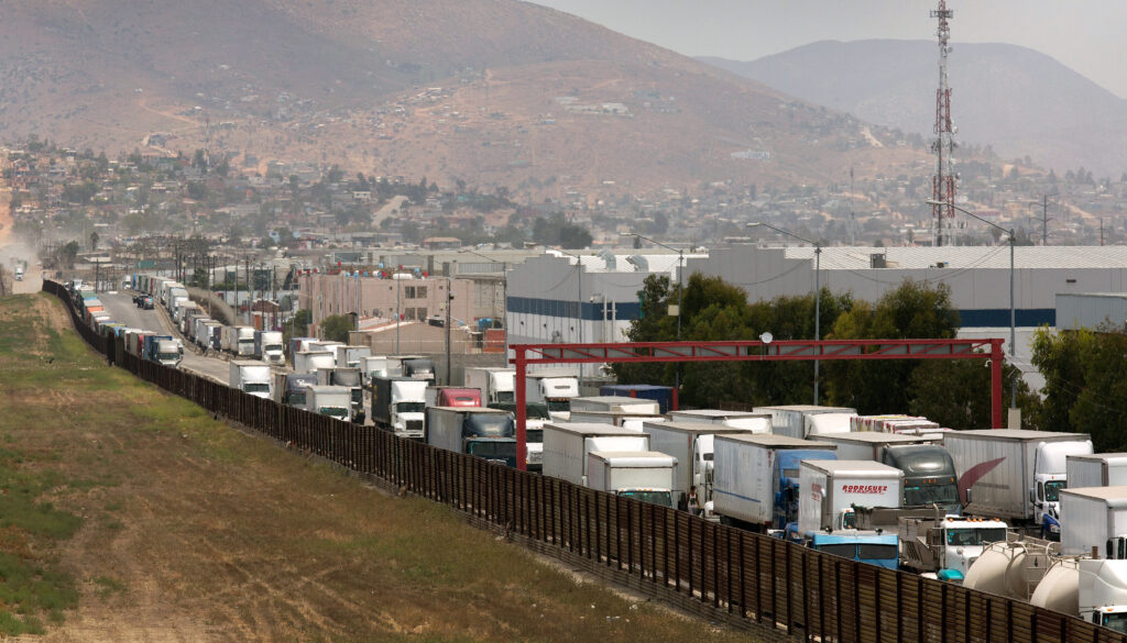 A long line of trucks at the U.S.-Mexico border at San Diego, California