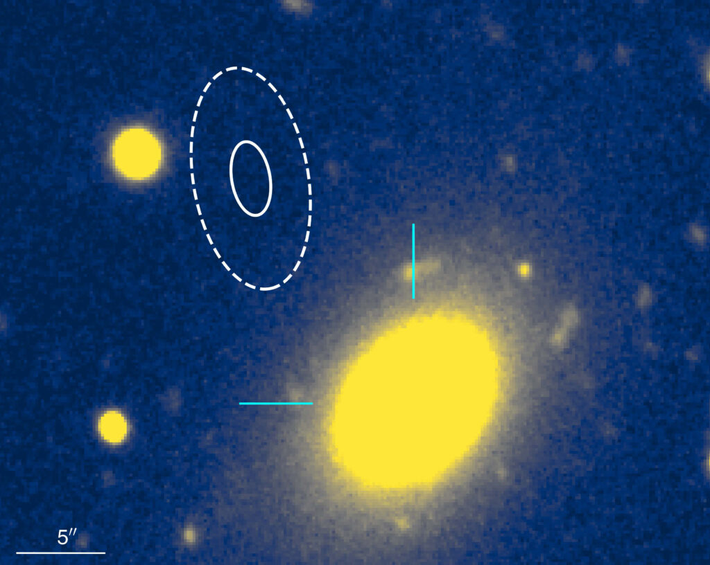 yellow blobs representing a galaxy and foreground stars against a blue background