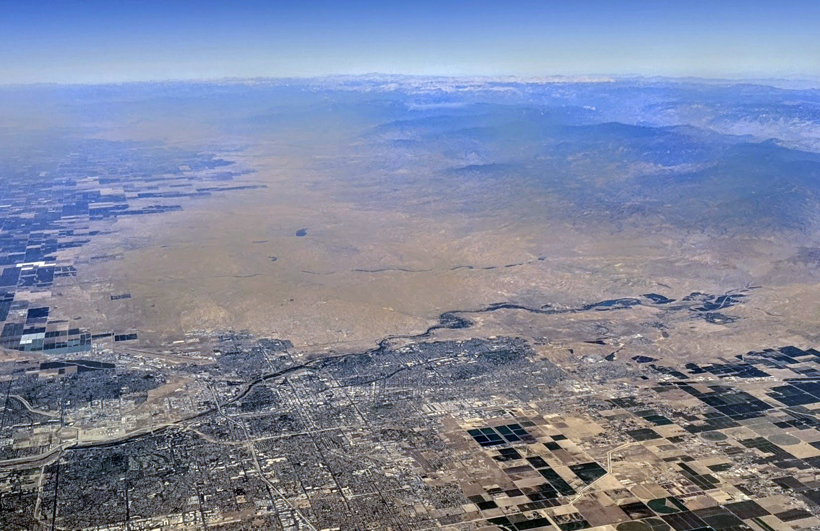 An aerial view of Bakersfield, California, and vicinity, showing the Kern River coming from the southern Sierra Nevadas