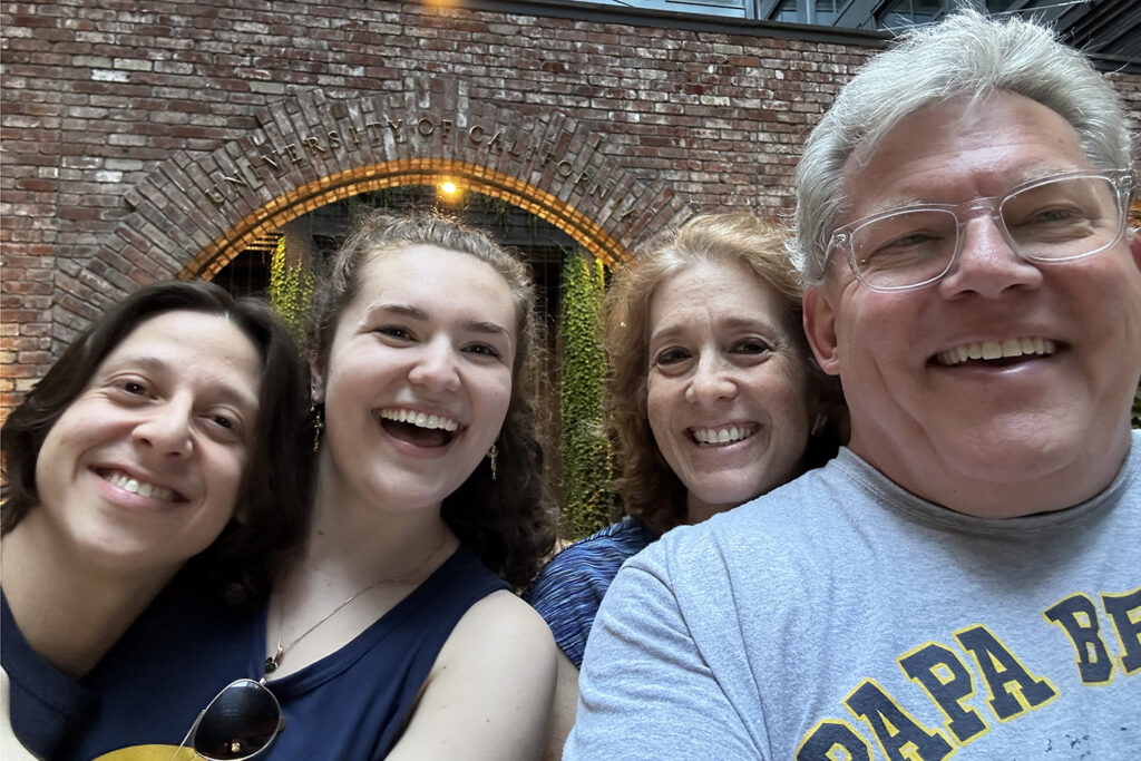 Erin Wall, a student at Anchor House, poses for a selfie with her father, her father's partner and Erin's boyfriend.