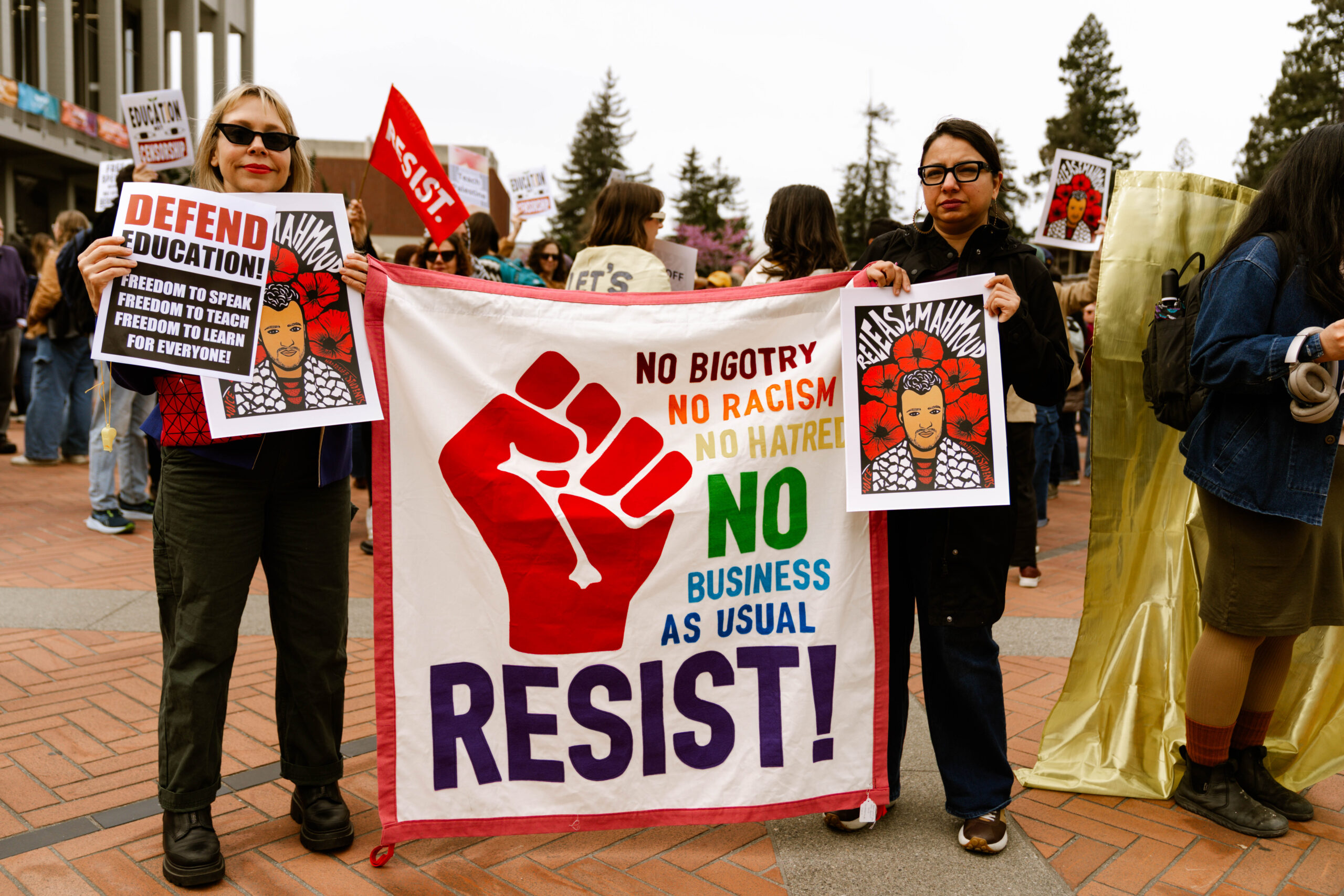 Protestors gather on Sproul Plaza for a rally against Trump administration attacks on higher education.