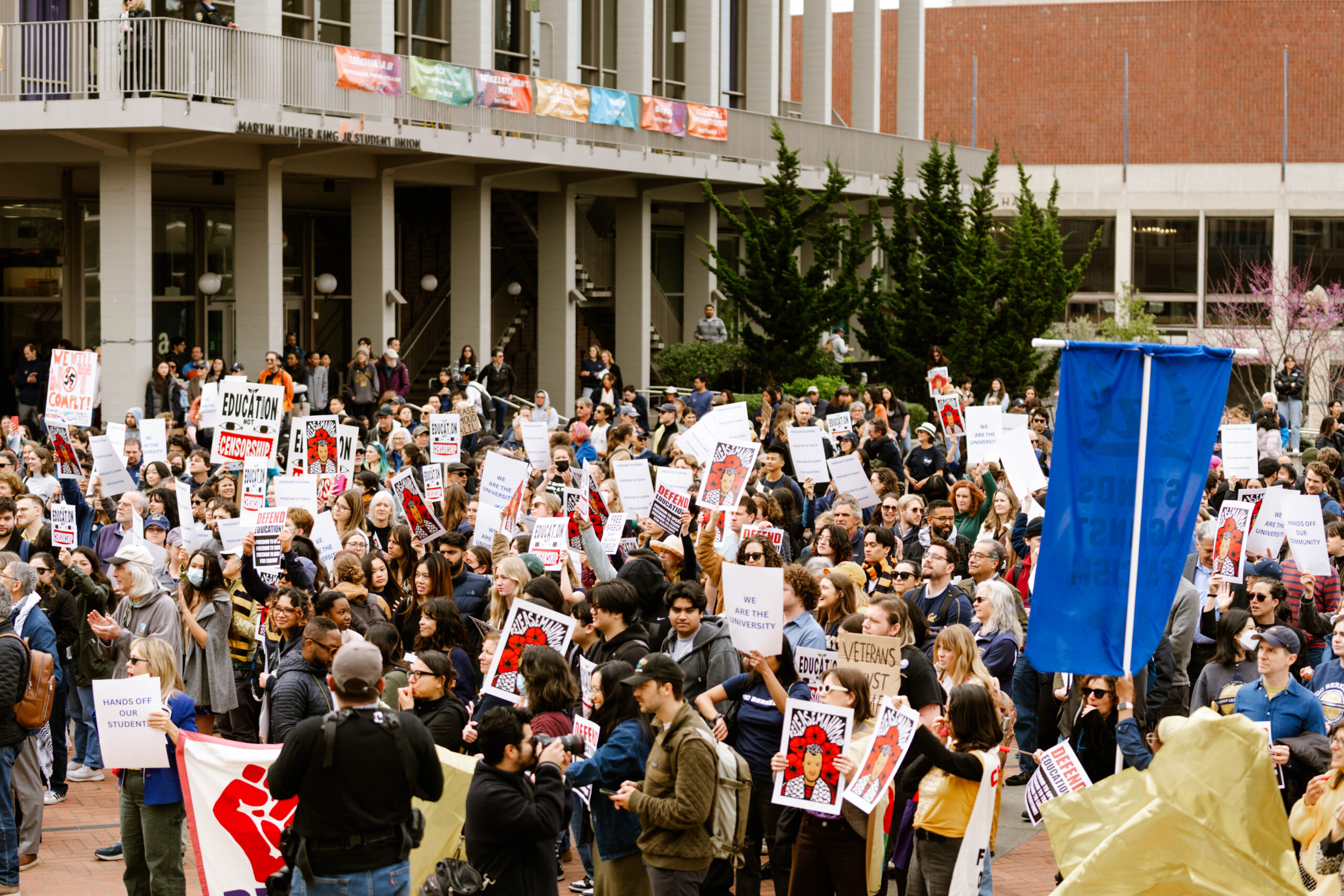 Protestors gather on Sproul Plaza for a rally against Trump administration attacks on higher education.