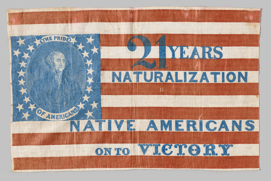 an American flag with George Washington in the center of the blue section and the words "21 years naturalization. Native Americans on to victory"