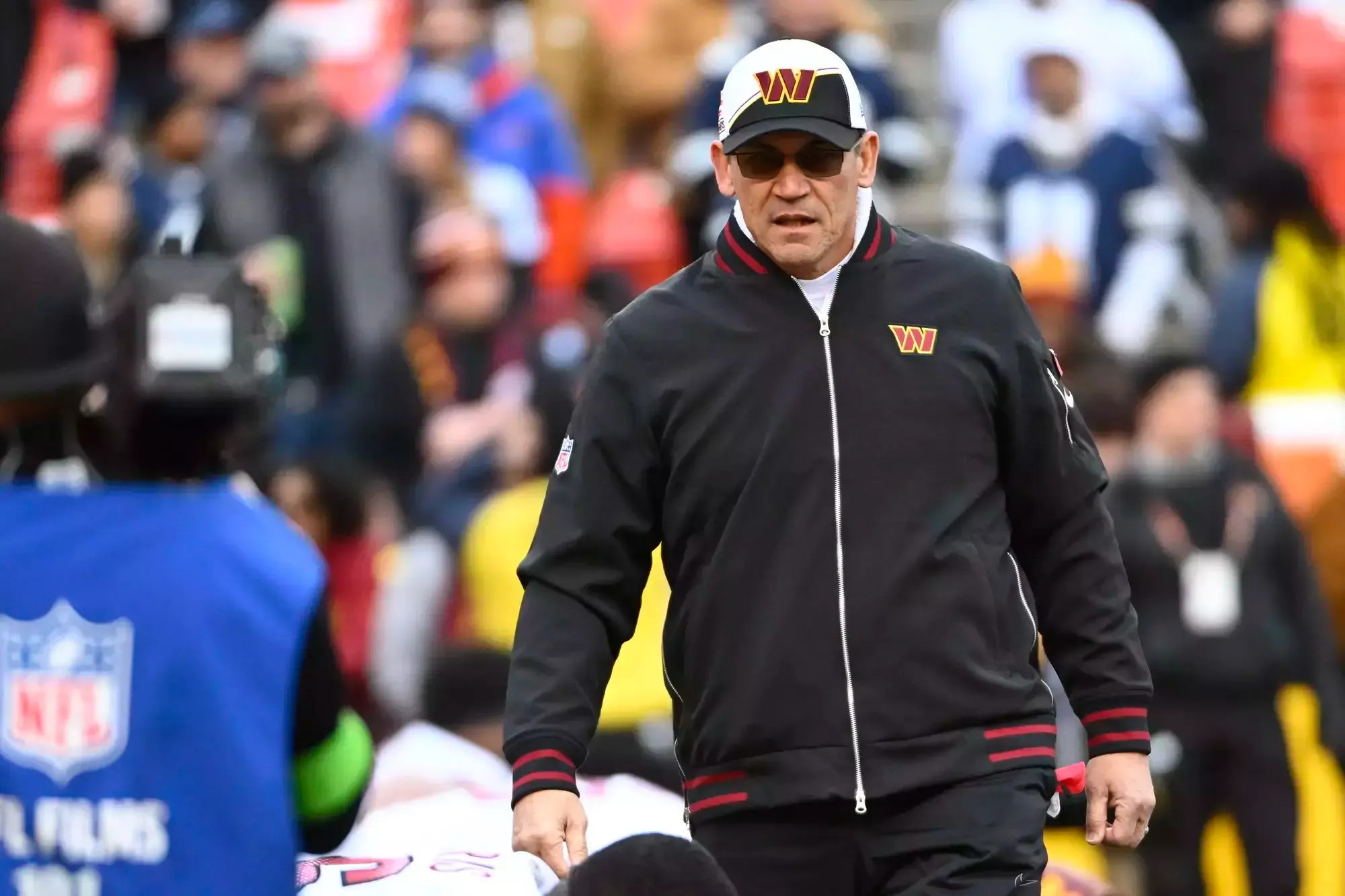 Ron Rivera pictured on field as head coach of the Washington Commanders.