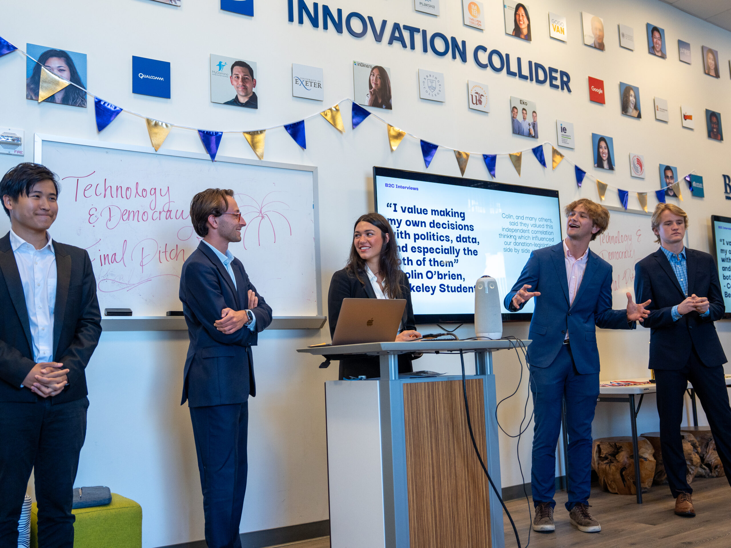 People standing in front of a room deliver a closing pitch about the platform SimpleGov.