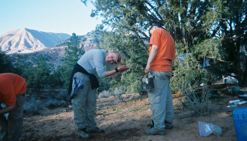 Emily smiles as she washes her hair during a wilderness therapy program in 2010, when she backpacked through Southern Utah