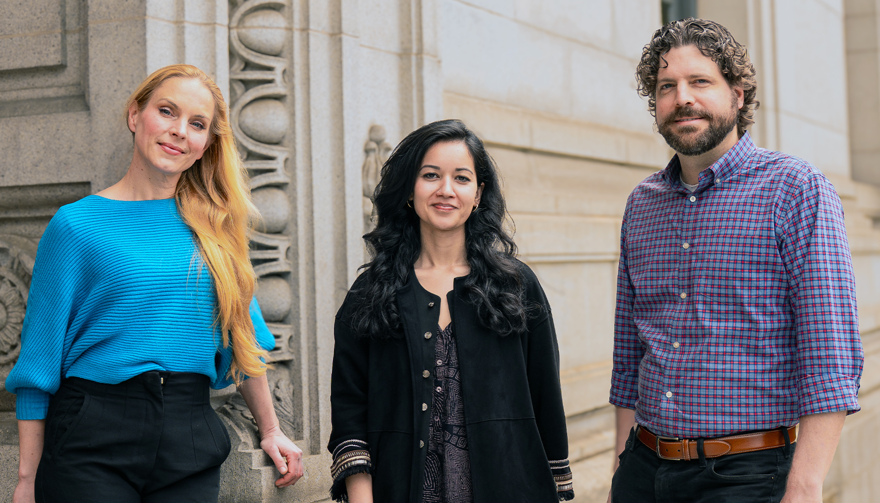 Group portrait featuring (left to right): Julia Schaletzky, Smriti Mehta and Will Fithian, against the carved-stone backdrop of an elegant old campus building.