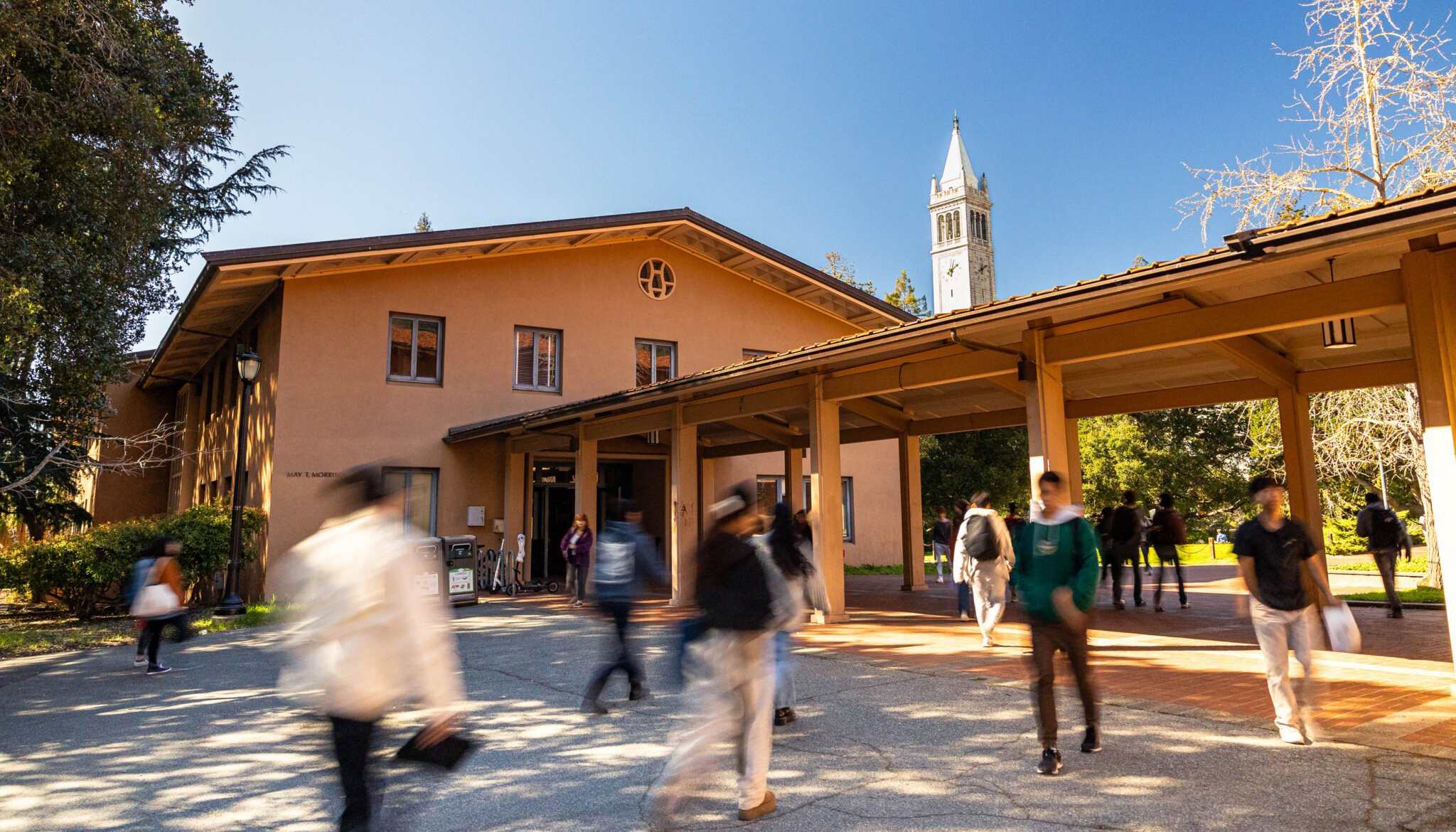 uc berkeley students walk by the music department's Morrison Hall on campus