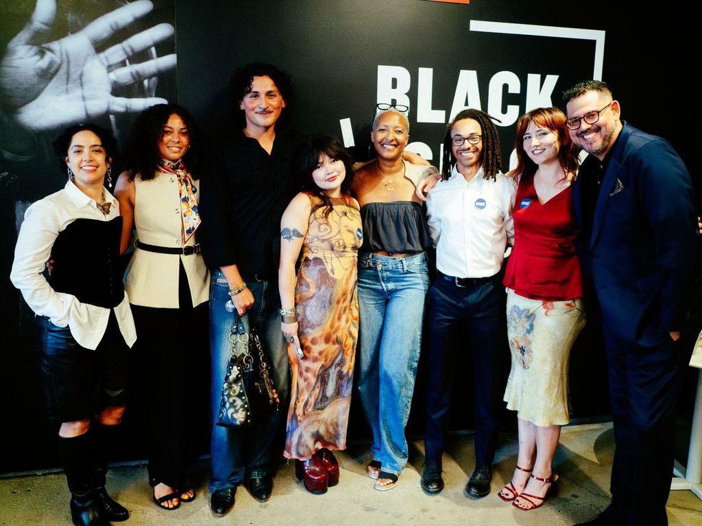 The members of the Archive of Urban Futures collective celebrate the exhibition opening: from L to R, Clara Pérez Medina, Maya Sapienza, Mateo Villa, Krista McAtee, Dr. Brandi Summers, juleon robinson, Cat Summers Stoehr, Bobby Ortiz Stahl.