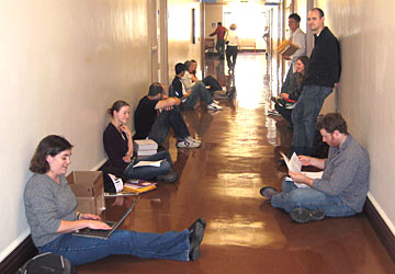 PhD students wait to turn in their printed dissertations