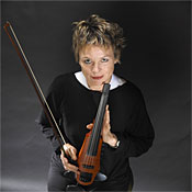 Laurie Anderson holding a violin.