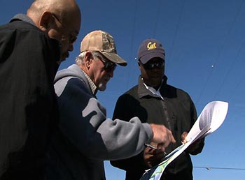 Kofi Inkabi (right), a UC Berkeley post-doctoral researcher, interviews Sherman Island Reclamation District engineers Henry Matsunaga (left) and Gene Peck