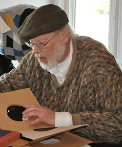 Antiquarian dealer looking through materials