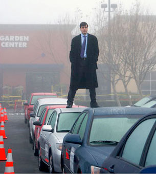 Alexandre Bayen stands atop a car 