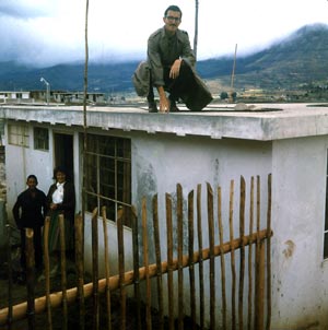 Peace Corps volunteer on house he built