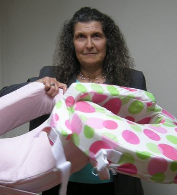 Arlene Blum holds some of the baby products that contain known or untested toxic flame retardants.