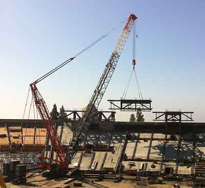 The third of the press box's three sections is lowered into place on Sunday, Oct. 9.