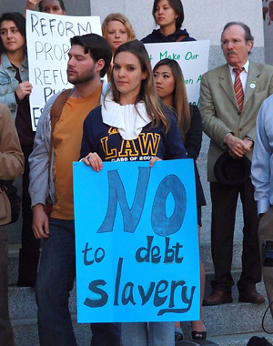 Student holds sign on Capitol steps