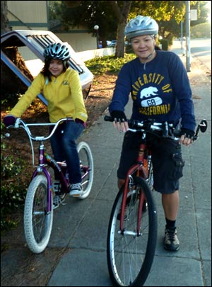 Staffer with her daughter on bikes