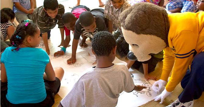 Young readers with BUILD mentor Daisy Zuniga