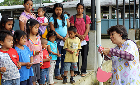 Dr. Cecilia Paz teaches children to brush